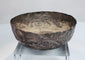 Engraved decoration on a 12th–13th century Seljuk silver bowl showing fine hand-worked patterns and historic surface wear.