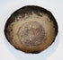 Interior of a Seljuk silver bowl showing natural oxidation, surface wear, and preserved hand-forged construction.