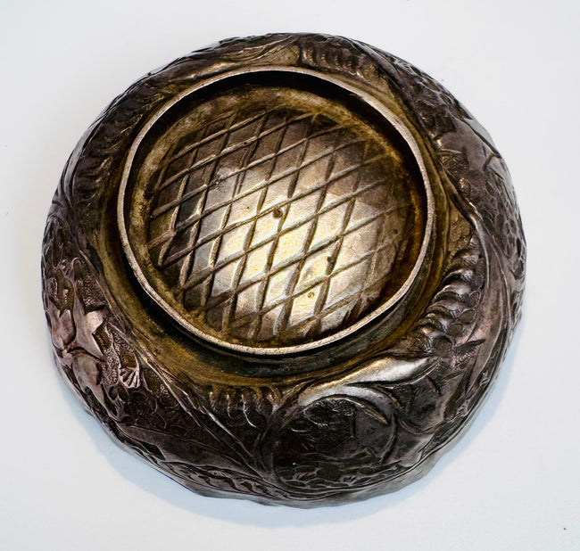 Medieval Islamic metalwork bowl from Persia with delicate engraved ornamentation reflecting Seljuk artistic craftsmanship.