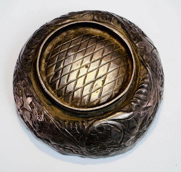 Medieval Islamic metalwork bowl from Persia with delicate engraved ornamentation reflecting Seljuk artistic craftsmanship.