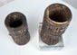 Pair of hand-carved Tibetan bone prayer wheels with preserved relief decoration and natural age-related patina.