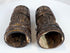 Historic Tibetan Buddhist prayer wheels made from human femur bone, combining ritual function with intricate hand-carved decoration.