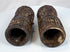 Rare pair of Tibetan Buddhist human bone prayer wheels with carved Buddha figures, sacred inscriptions, and centuries-old surface wear.