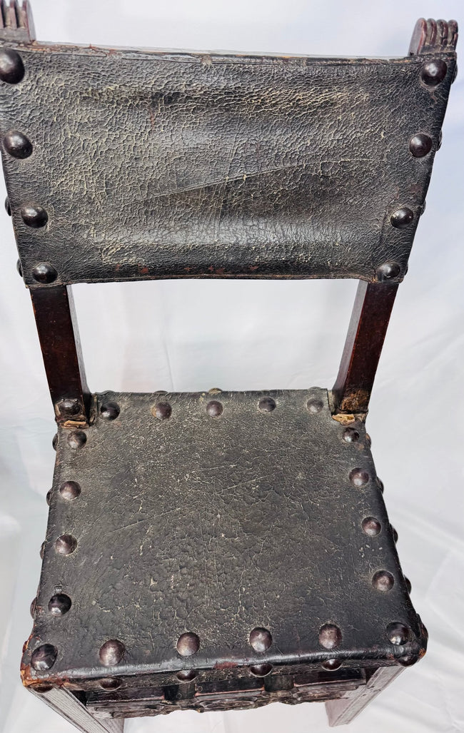 Detail of craquelure and historic wear on 17th-century chair leather
