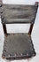 Detail of craquelure and historic wear on 17th-century chair leather