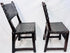Matched Spanish Baroque side chairs displaying centuries-old patina and wear