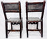 Antique leather-upholstered chairs with dark walnut frames and metal studs