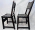 Side view of an antique Spanish walnut chair with leather seat and back
