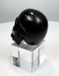 Rear view showing the rounded cranium of the miniature carved skull