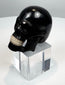 Front view of a carved horn memento mori skull with articulated teeth