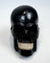 Miniature polished black horn skull carving, circa 1880–1950