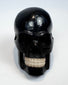 Miniature polished black horn skull carving, circa 1880–1950