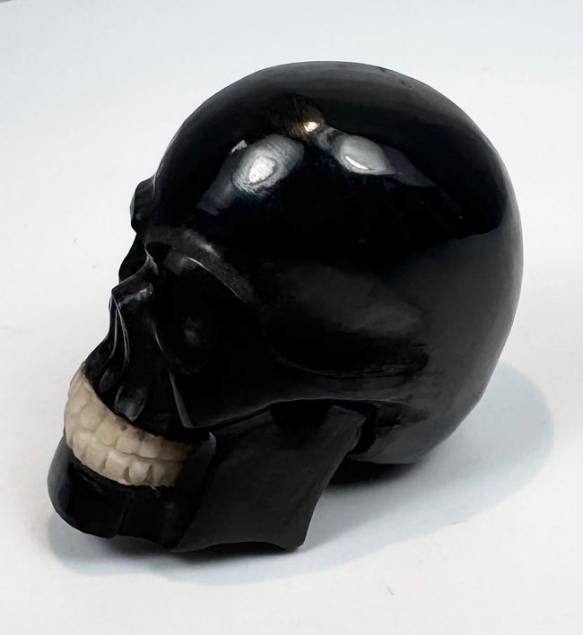 Cabinet-of-curiosities miniature skull carving dating circa 1880–1950