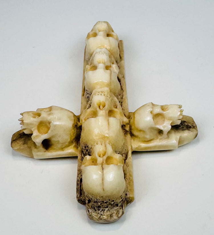 Detailed bone carving with recessed skull eyes, nasal cavities, and teeth