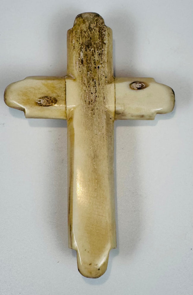 Late 19th-century memento mori skull cross with aged honey-brown patina