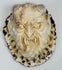 Hand-carved deer antler plaque depicting a fierce Japanese oni