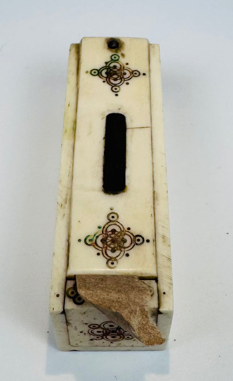 Historic miniature bone domino game displayed with its fitted case