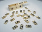 Close-up of antique bone domino tiles with dark inlaid pips