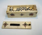 Handcrafted bone domino tiles with black pips and central dividing lines