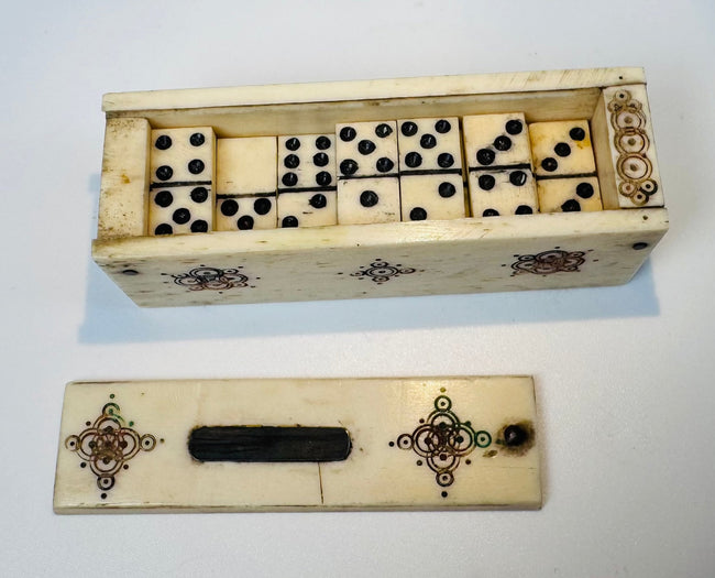 Carved bone domino box with geometric and floral polychrome decoration