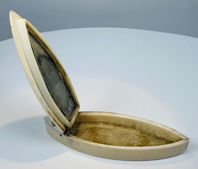 Antique bone toothpick case showing hinged lid and aged metal fittings