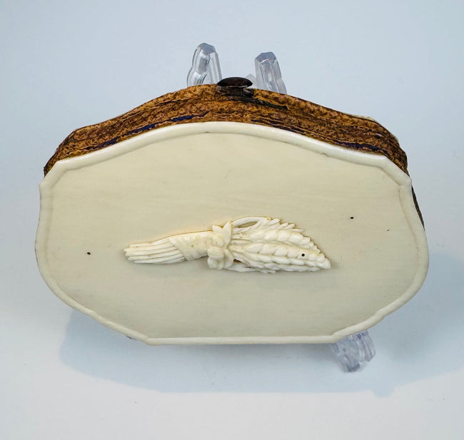 Late 19th-century Victorian coin purse with polished bone covers and purple silk interior