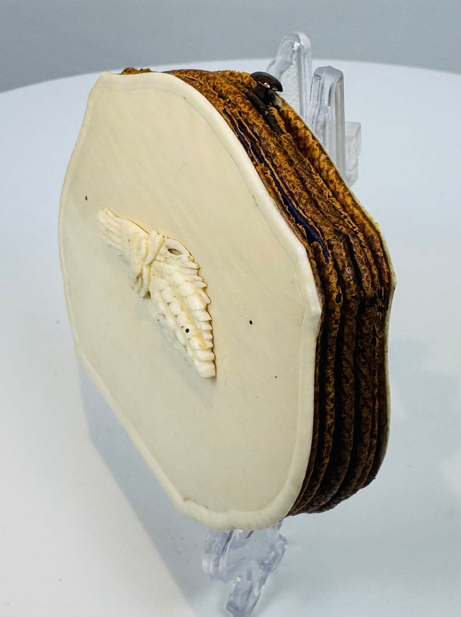 Open Victorian pocket purse showing deep purple silk-lined accordion compartments