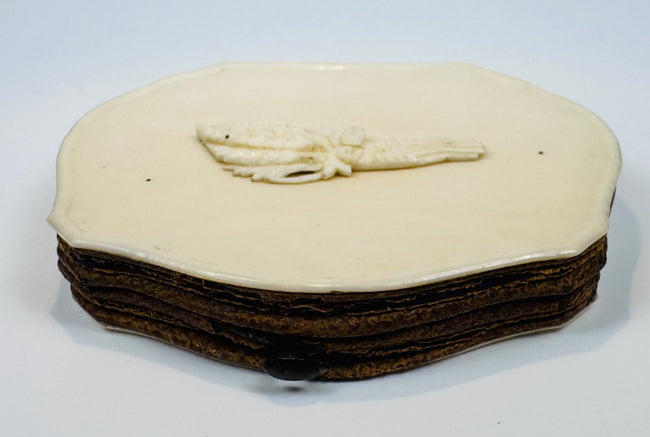 Compact 19th-century carved bone purse with original-style metal clasp and aged patina