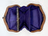 Interior view of Victorian change purse with multiple silk compartments and metal frame