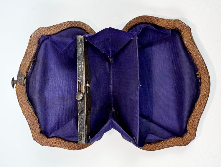 Interior view of Victorian change purse with multiple silk compartments and metal frame