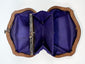 Interior view of Victorian change purse with multiple silk compartments and metal frame
