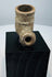 Side view of antique African pottery pipe bowl with projecting stem opening