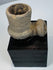 Side view of ancient stone elbow pipe with deep cylindrical smoking bowl
