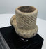 Engraved diagonal grooves decorating an ancient North American stone pipe bowl