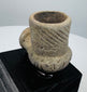 Engraved diagonal grooves decorating an ancient North American stone pipe bowl