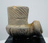 Archaeological North American smoking pipe with mineral deposits and worn carved details