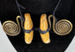 Traditional Naga hunting status ornament with symmetrical concentric brass spirals