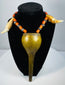 Konyak Naga necklace from Northeast India with orange-red trade beads and monumental brass pendant