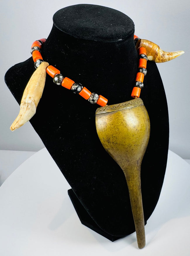 Historic Naga warrior necklace featuring paired animal teeth, spotted beads and fibre cord