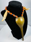 Historic Naga warrior necklace featuring paired animal teeth, spotted beads and fibre cord