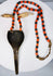 Naga warrior adornment with large brass pendant, paired animal teeth and colourful glass beads