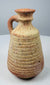 Roman–Late Antique pottery jug with ribbed body and reddish-buff clay surface