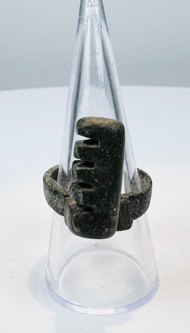 Close-up of an ancient Roman ring key showing four divided locking teeth