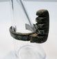 Front view of an ancient Roman ring key with stepped locking teeth and mineral deposits