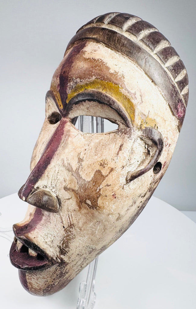 Lower Congo wooden mask with surviving white, yellow, red-purple and brown pigments
