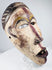 Hand-carved Lower Congo mask displaying aged pigment, abrasions and surface patina