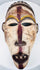 Front view of a carved Yombe mask with narrow eyes, prominent nose and open mouth