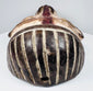 Historic Yombe-style mask with worn polychrome decoration and attachment holes