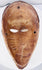 Mid-century African ethnographic mask with elongated face and geometric coiffure