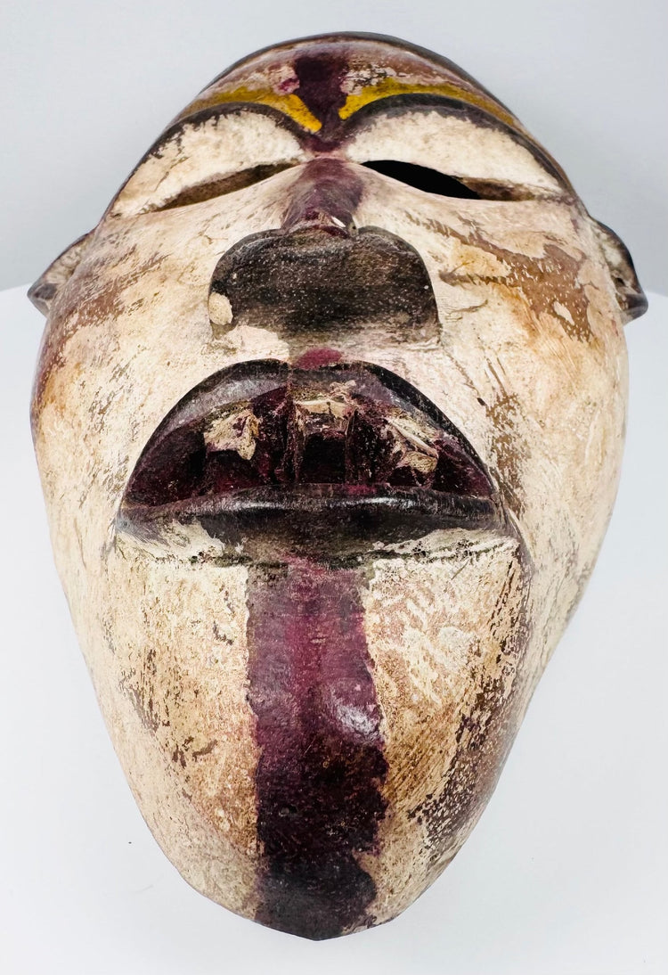 Reverse view of a hollowed African wooden mask with visible hand-tool marks